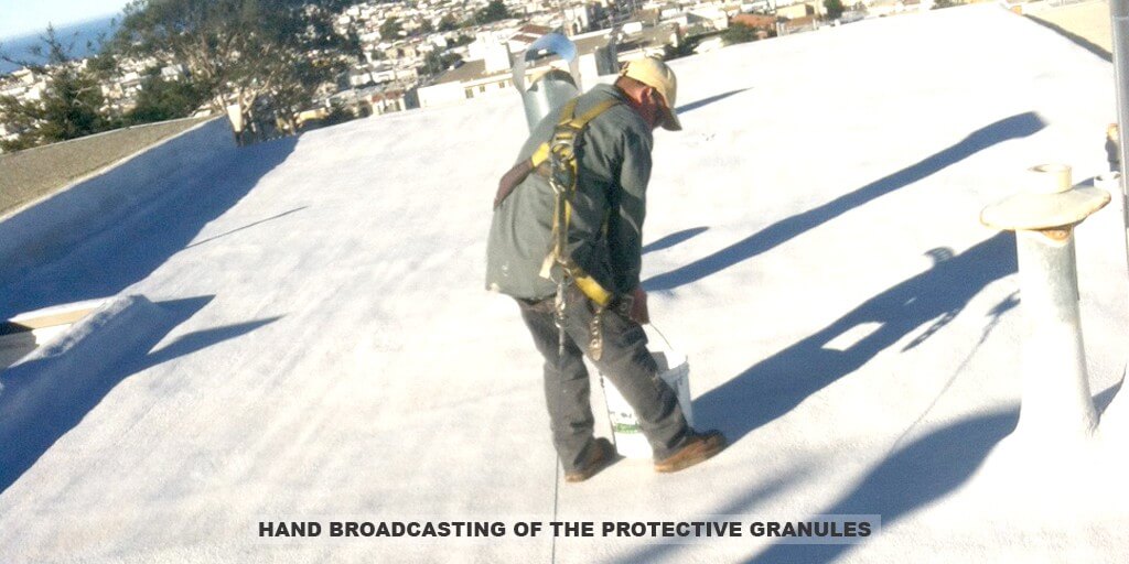 Armstrong Roofing - flat roof spf foam installation with an installer spraying the roof