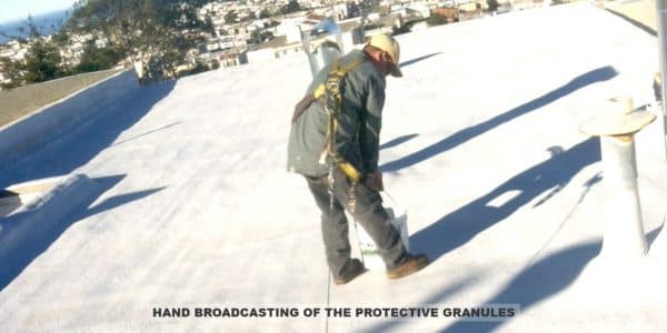 Armstrong Roofing - flat roof spf foam installation with an installer spraying the roof