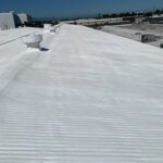 Camino Storage facility in Santa Clara showing the freshly coated white spray foam roof gleaming under the California sun