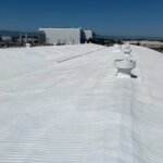 Camino Storage facility in Santa Clara showing the freshly coated white spray foam roof gleaming under the California sun