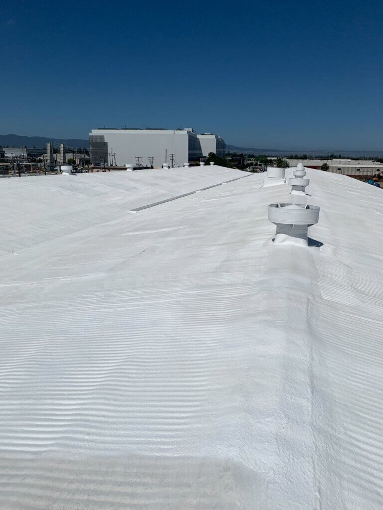 Camino Storage facility in Santa Clara showing the freshly coated white spray foam roof gleaming under the California sun