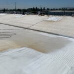 Camino Storage facility in Santa Clara showing the roof in the process of being sprayed with foam roofing