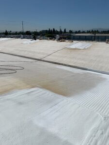 Camino Storage facility in Santa Clara showing the roof in the process of being sprayed with foam roofing