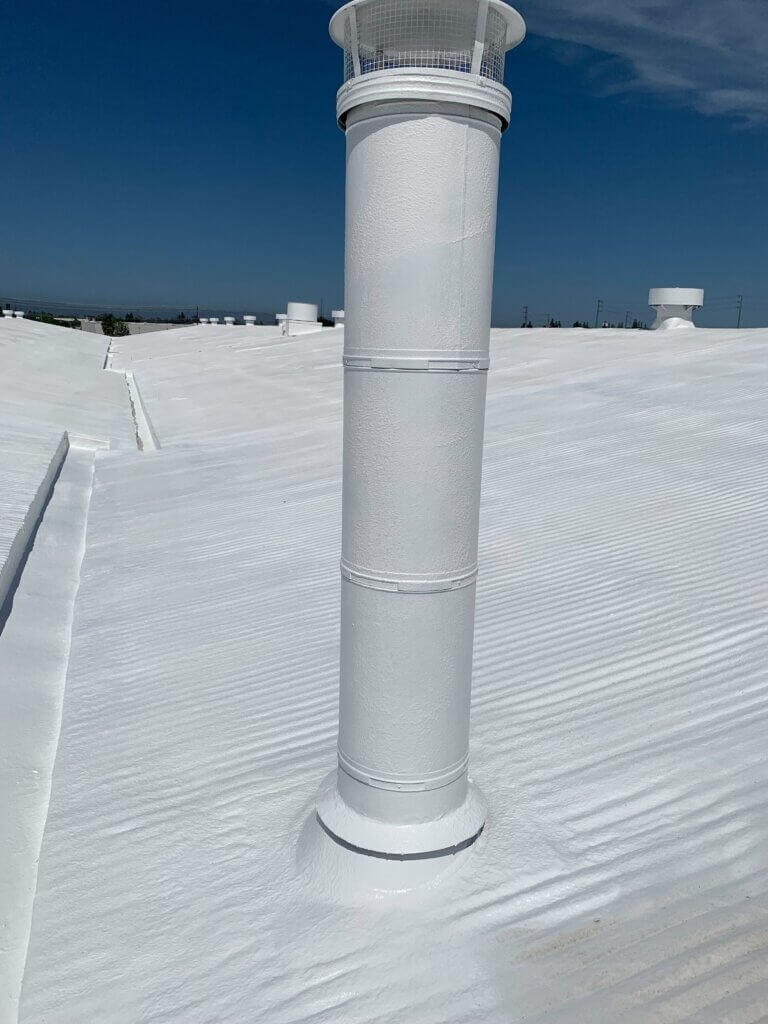 Camino Storage facility in Santa Clara showing the freshly coated white spray foam roof gleaming under the California sun