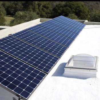 Flat roof with skylight and solar panels protect by Armstrong spf insulation