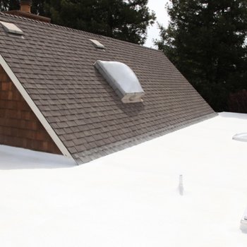 Armstrong Roofing - combination sloped-flat residential roof protected with spf roofing system