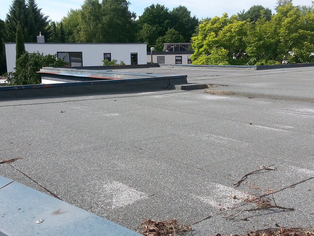 a tar and gravel flat roof with visible seams